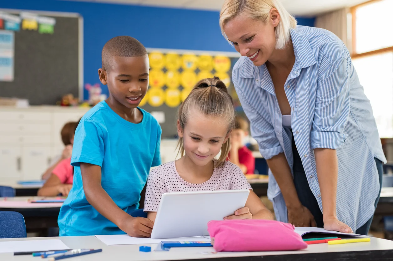 Kids using digital tablet in classroom
