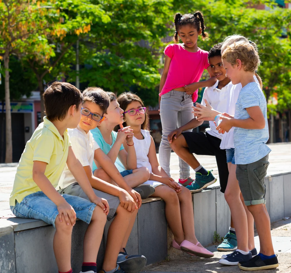 Eight,Children,Are,Talking,About,Play,On,Walk,In,The